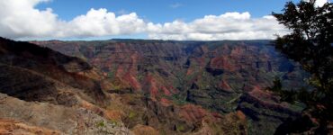 Red and green layered cliffs of Waimea Canyon on Kauai, Hawaii